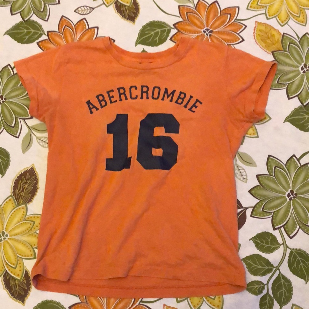 Abercrombie and Fitch orange shirt is in good condition.